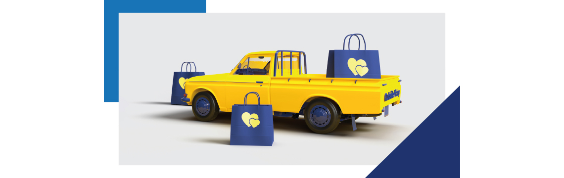 yellow truck with blue details and blue shopping bags